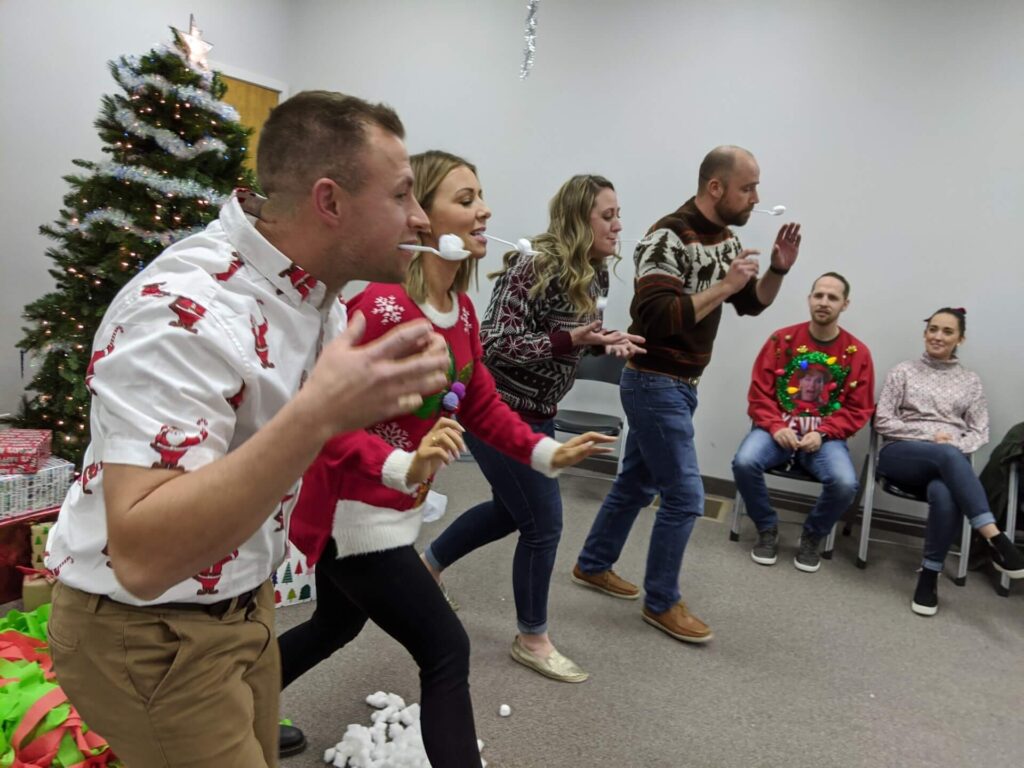 Adults Having Fun on a Marshmallow Challenge in a Christmas Party in Nampa, Idaho